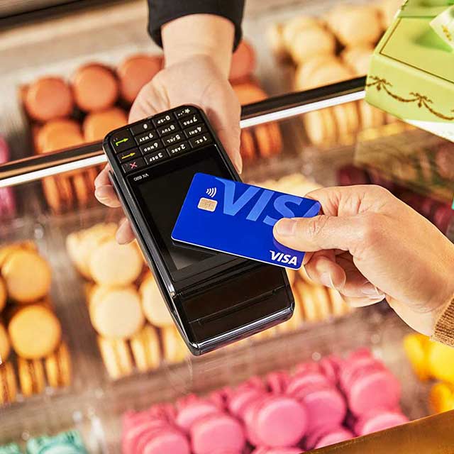 Customer at bakery using contactless payment